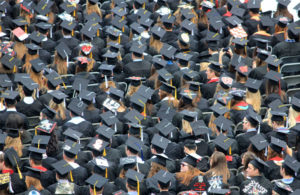 graduates dressed in caps and gowns